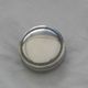 Small round silver metal box SNPA.
