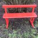 Red old schoolboy bench