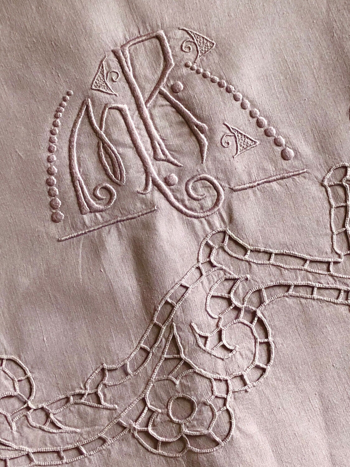 Old embroidered towel tinted purple aurora