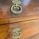 Restoration period walnut chest of drawers with a scroll handle