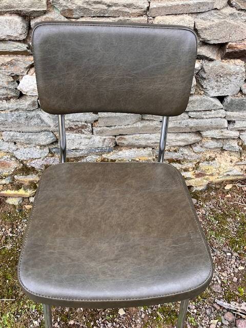 3 bronze-green faux leather chairs with chrome frames