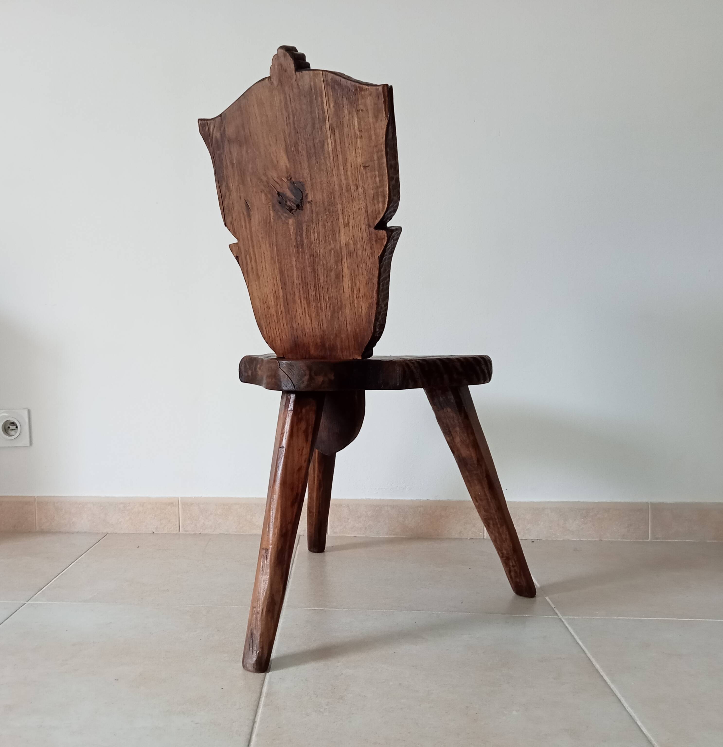 Brutalist tripod chair in carved wood 19th century
