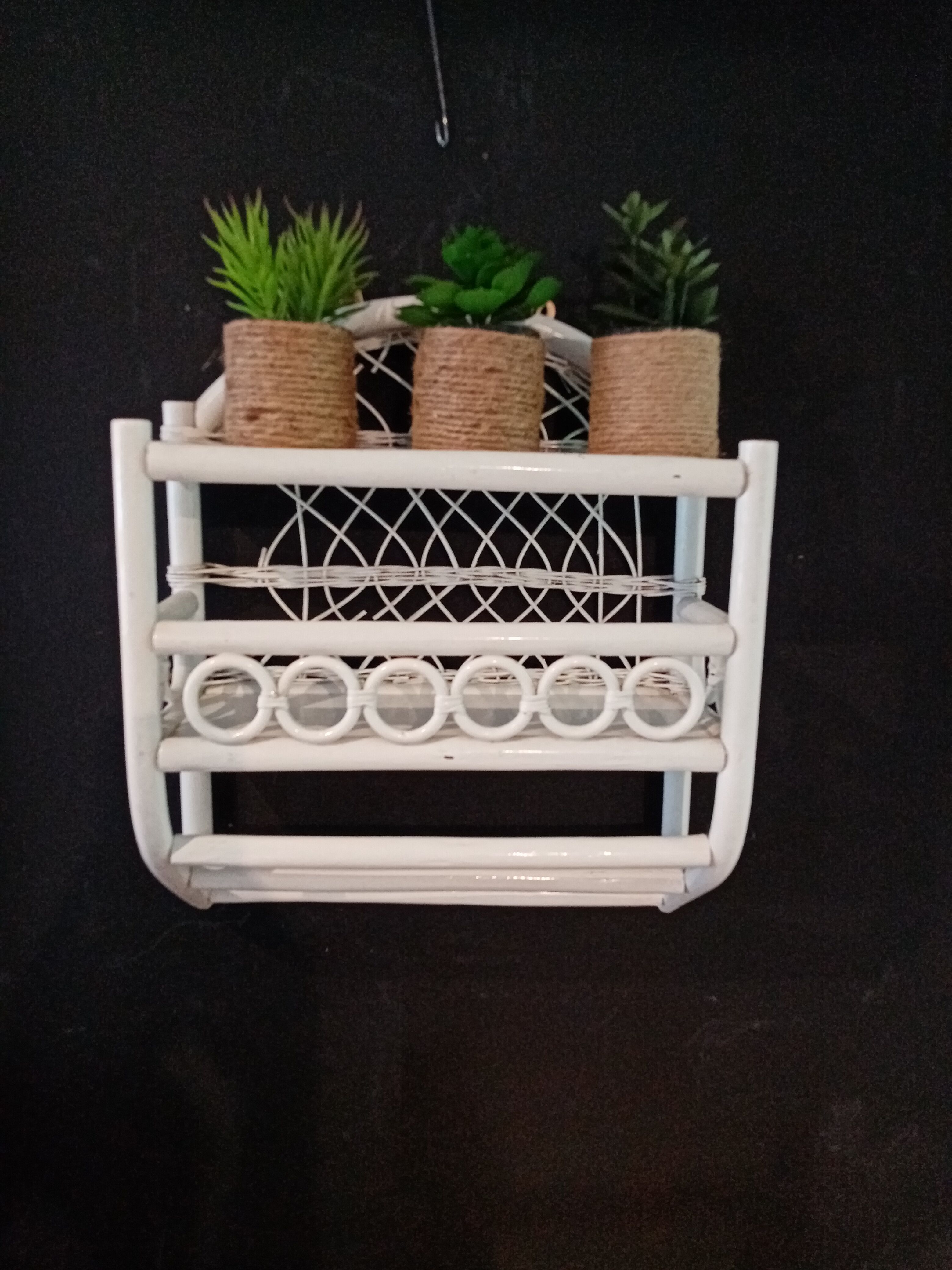 White rattan wall shelf