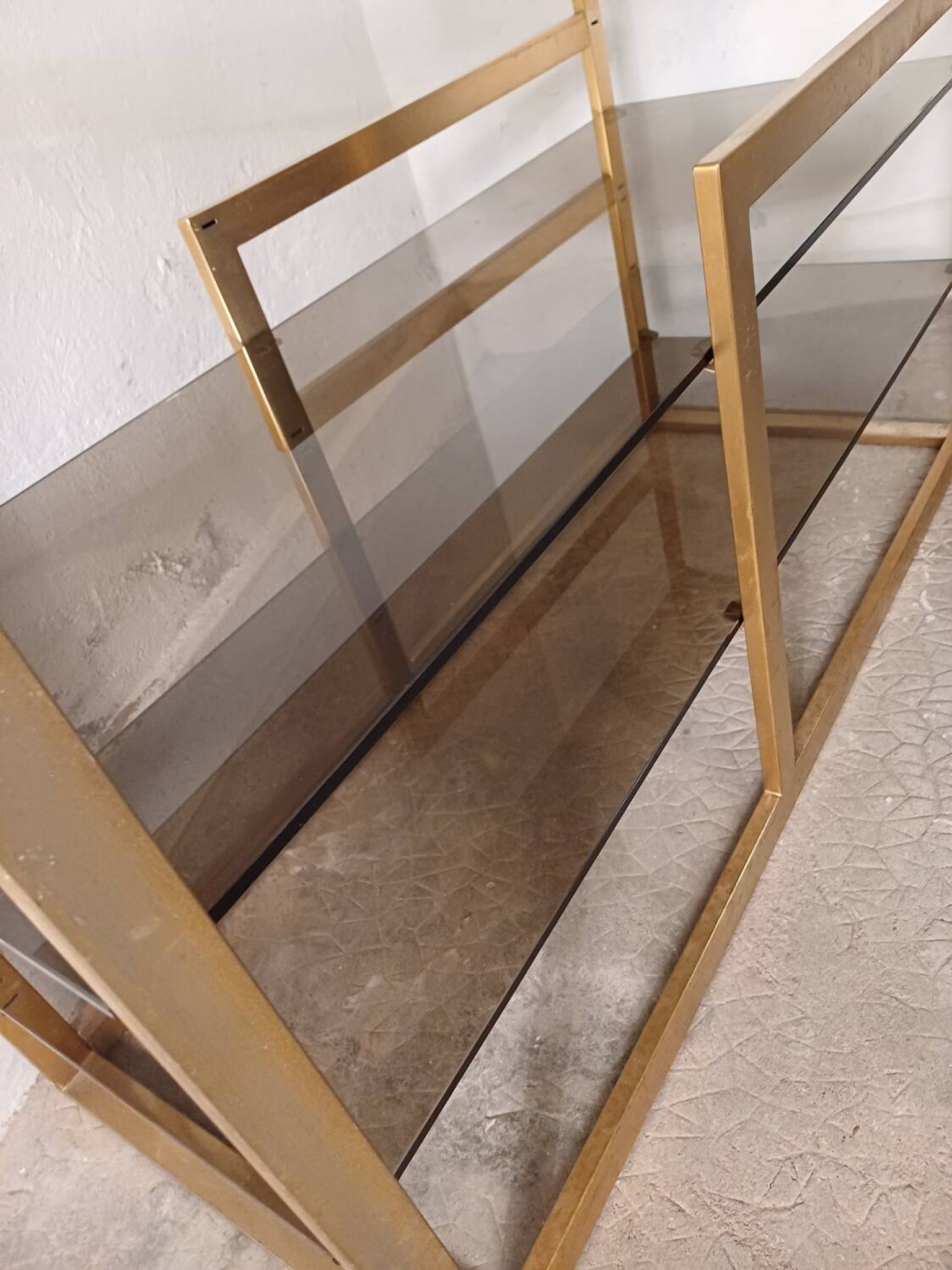 Brass shelf, smoked glass