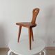 Low brutalist tripod chair in solid oak from the 1960s.