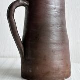Pitcher, watering can in dark brown ceramic with matte finish.