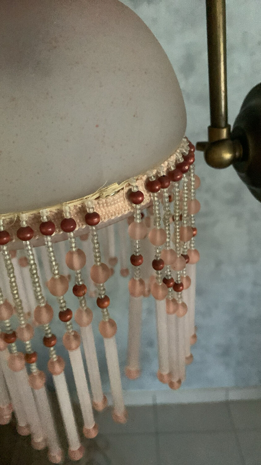 Pair of wall sconces in pink glass and pendants.