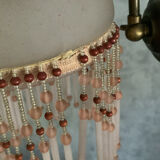 Pair of wall sconces in pink glass and pendants.