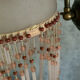 Paire d’appliques murales en verre rose et pampilles