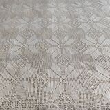 White cotton bedspread, crocheted sofa throw with star patterns