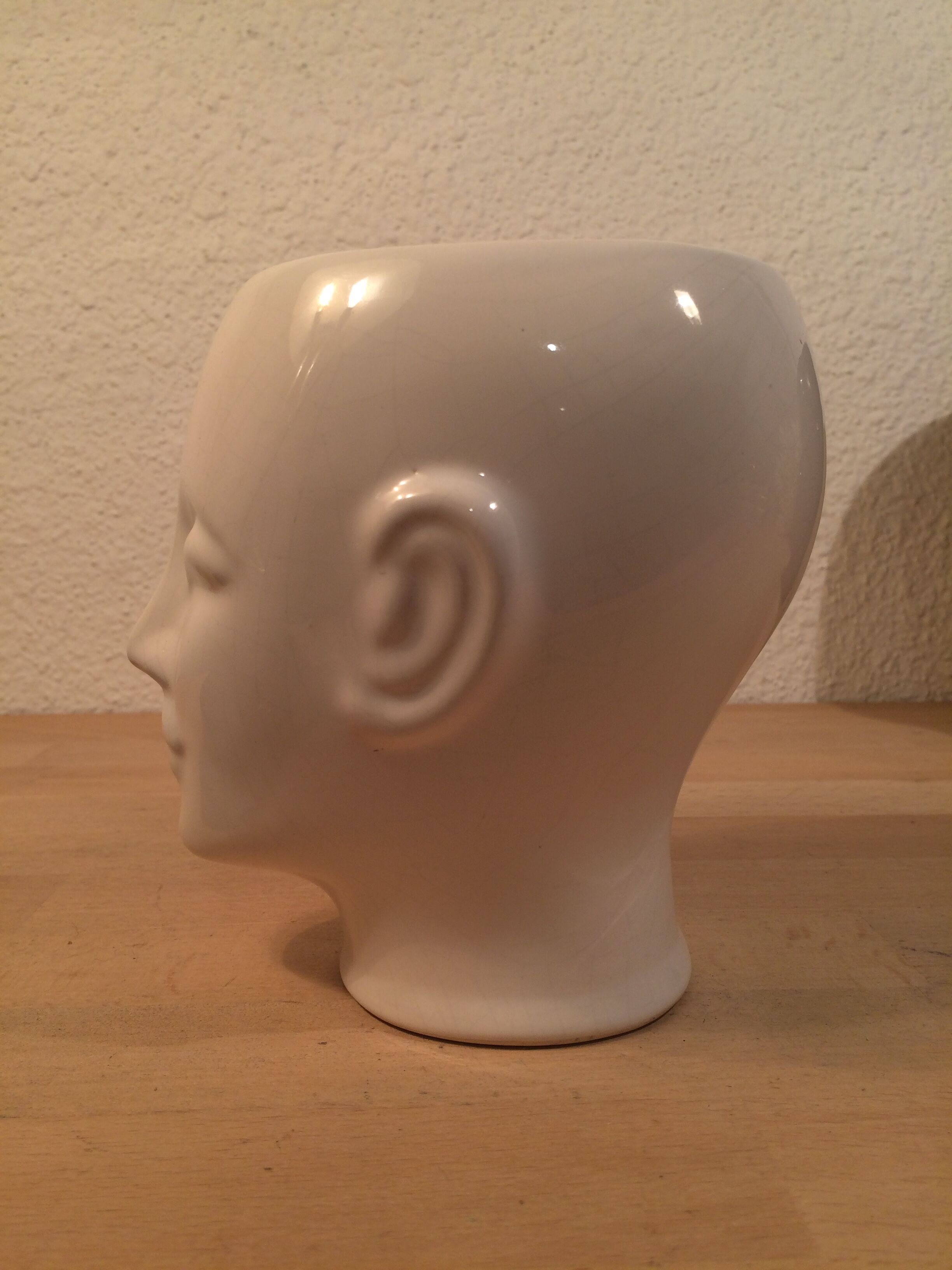 2 black and white ceramic head vases, face