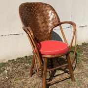 Vintage 1970s armchair in curved woven chestnut + seat cushion