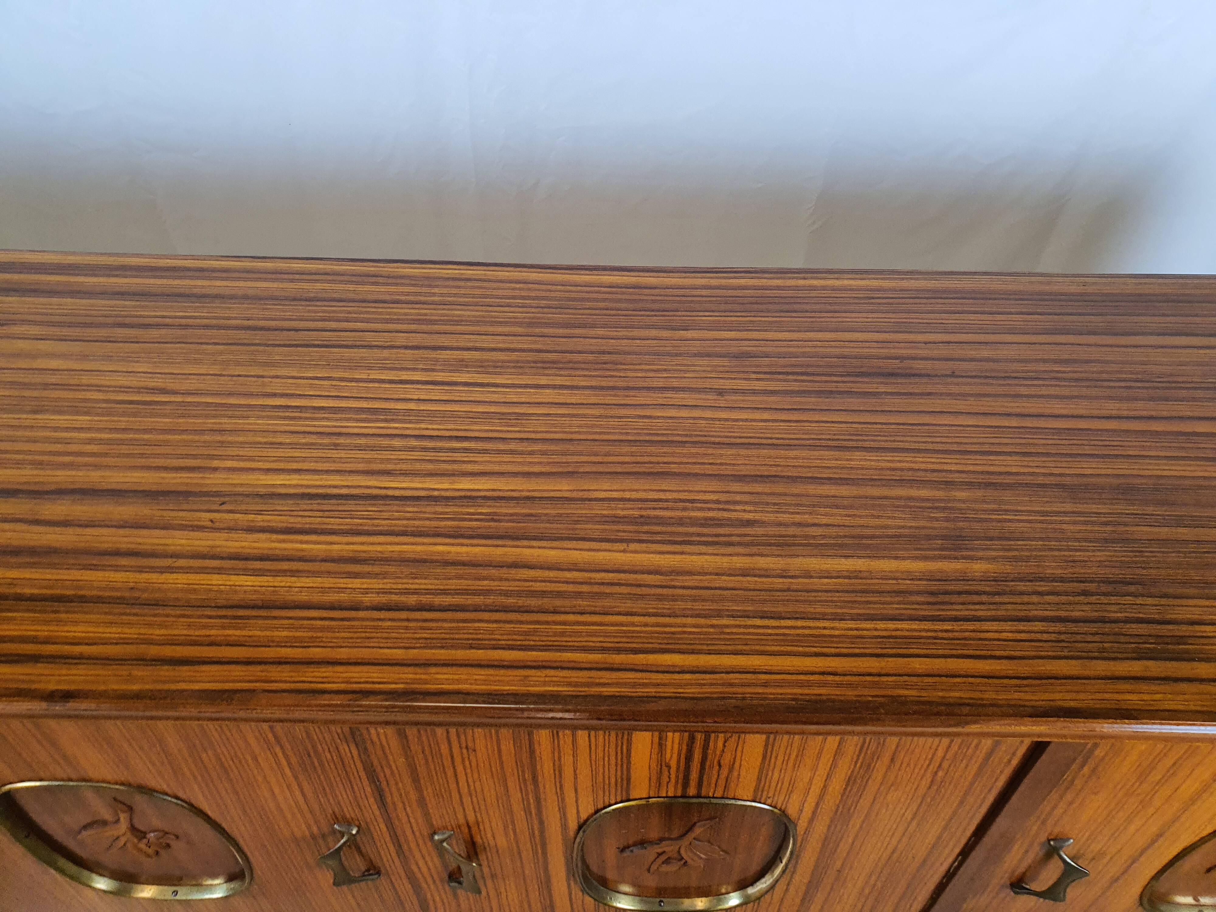 1960s sideboard with decorated doors in wood and brass