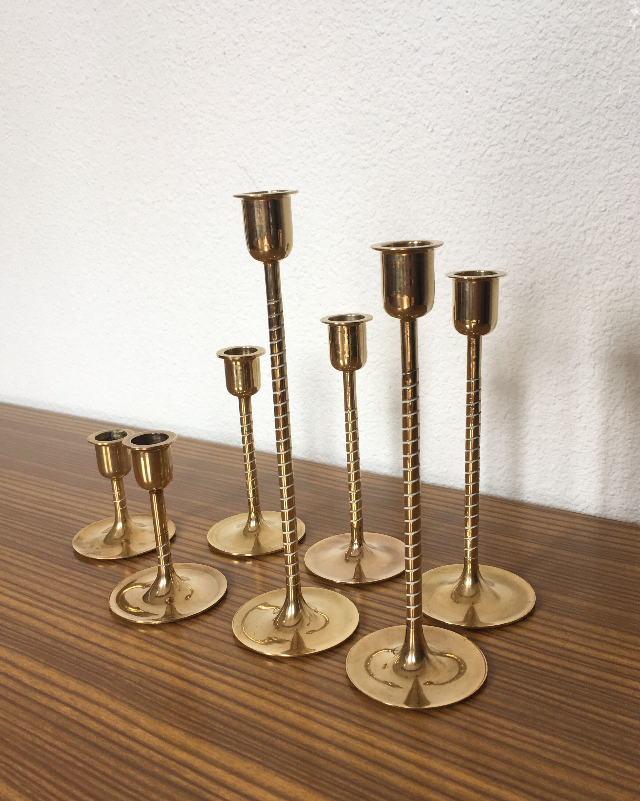 Series of 7 Scandinavian brass candlesticks