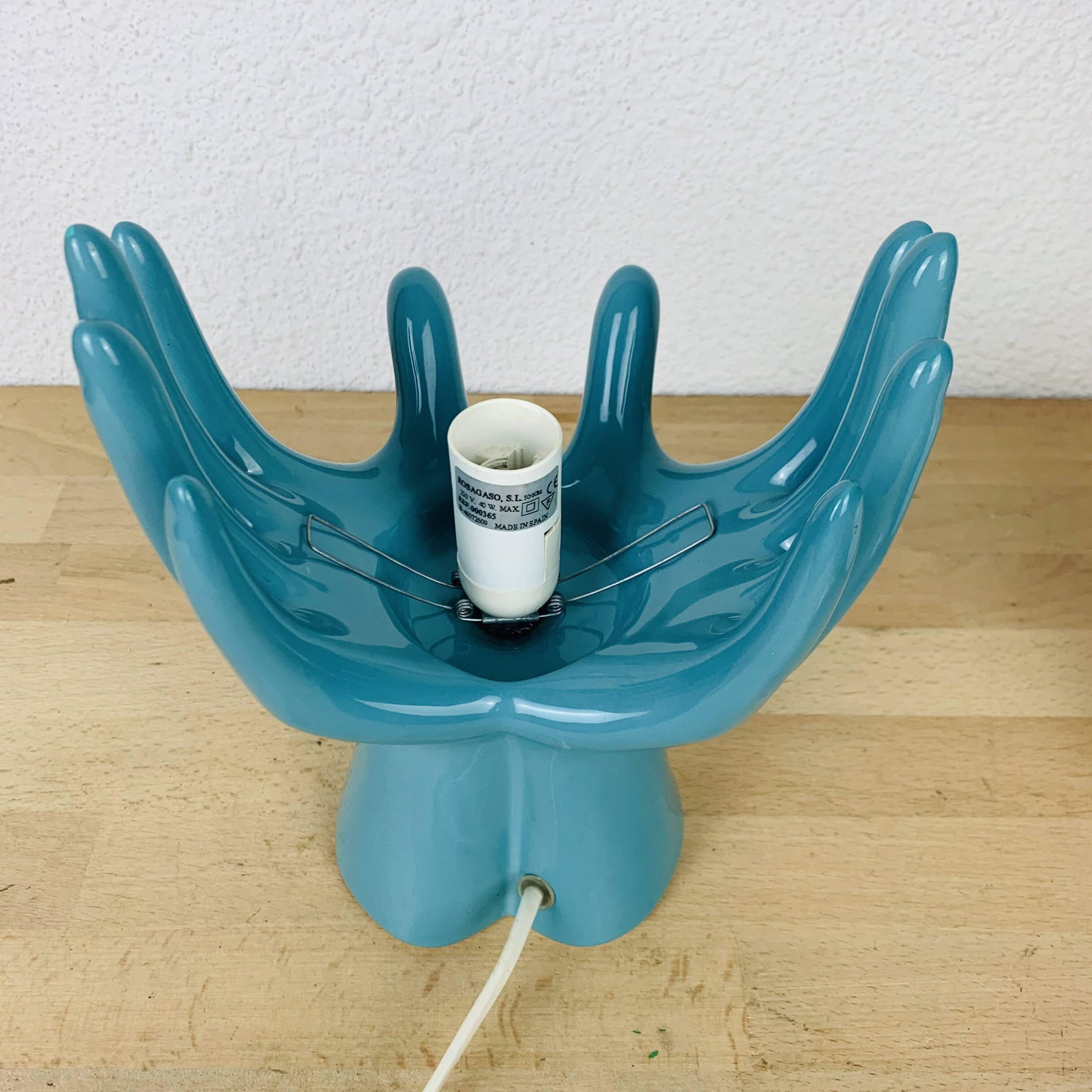 Blue ceramic hands lamp and glass globe