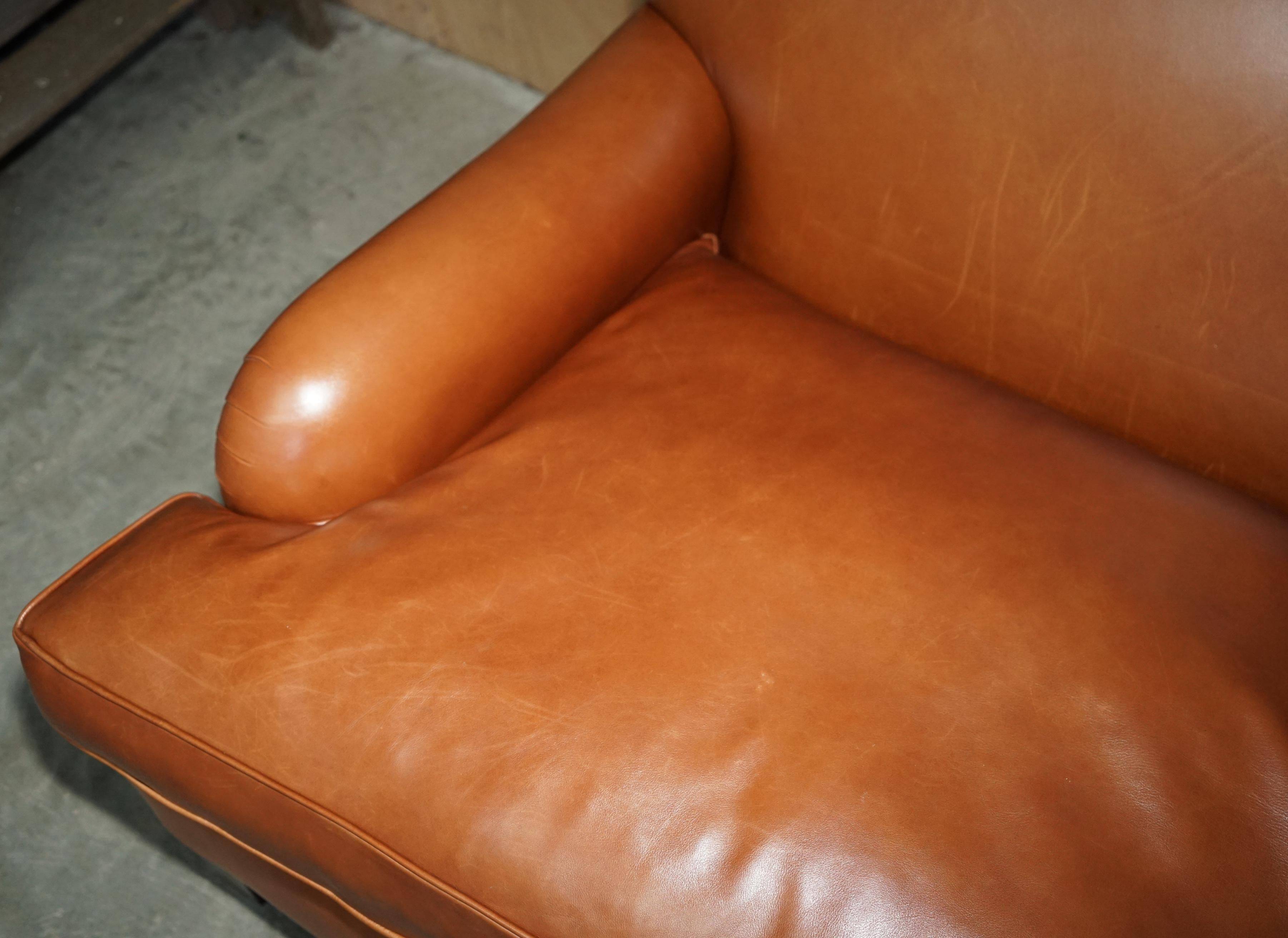 Two-seater leather armchair in Howard style by George Smith.