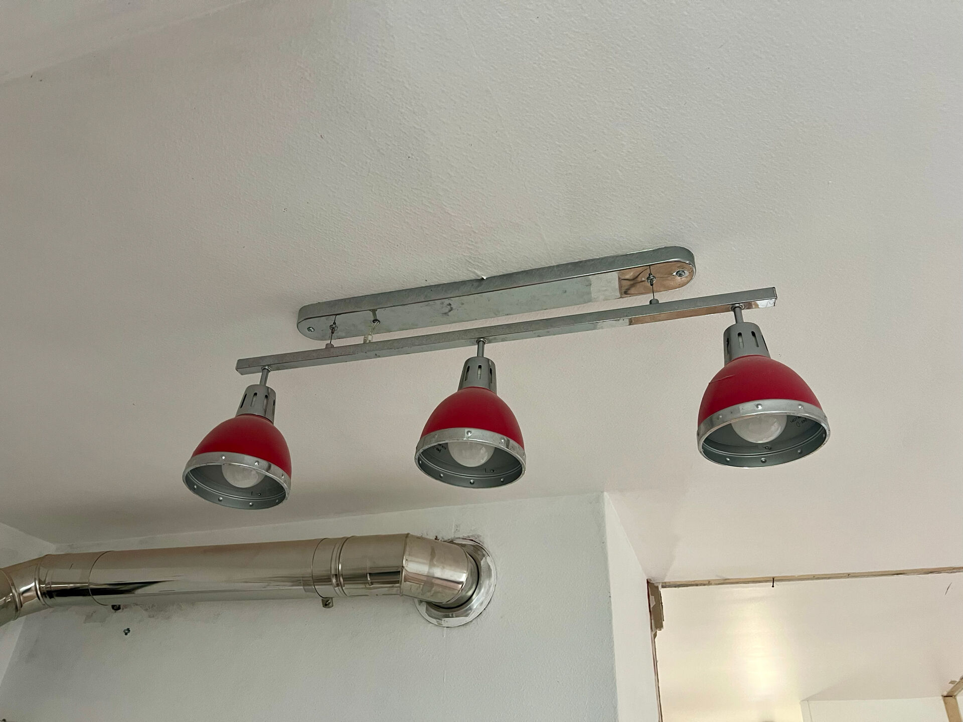 Designer pendant light with 3 red and chrome spots