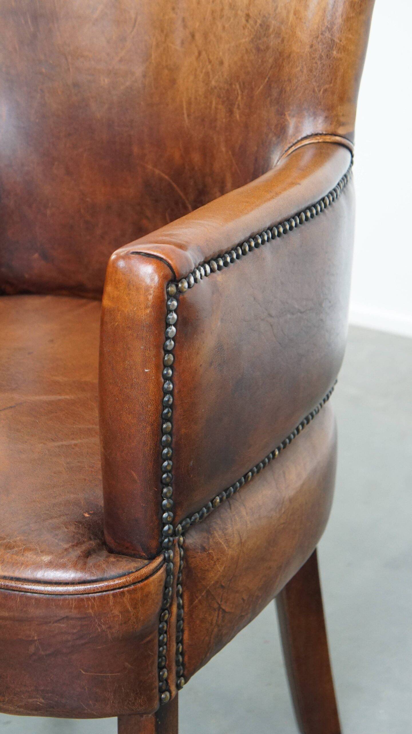 Amazing cognac-coloured sheepskin dining/side chair with armrests