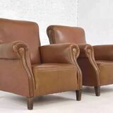 Pair of 1950s club armchairs in imitation leather and wood