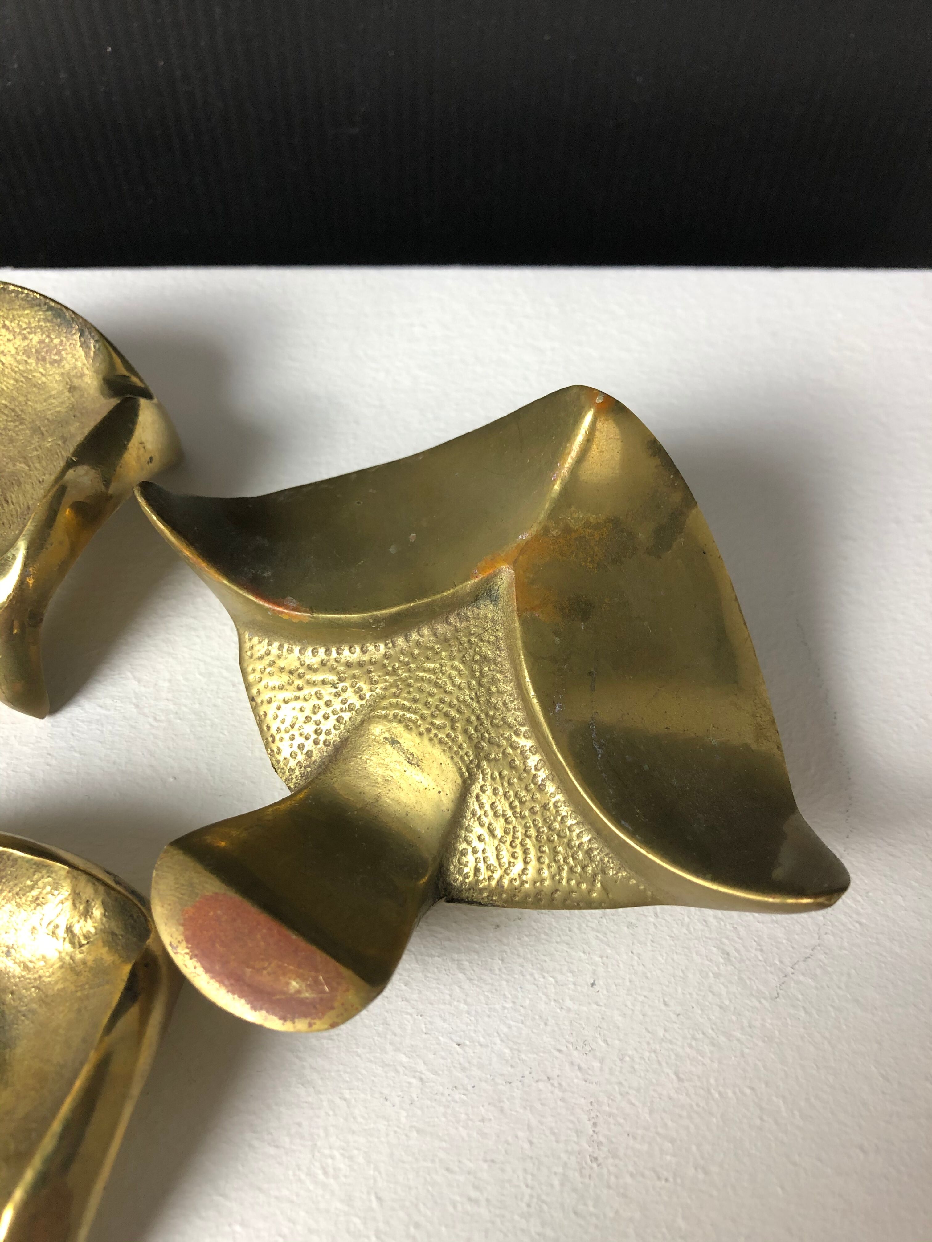 Suite of three bronze "ray"