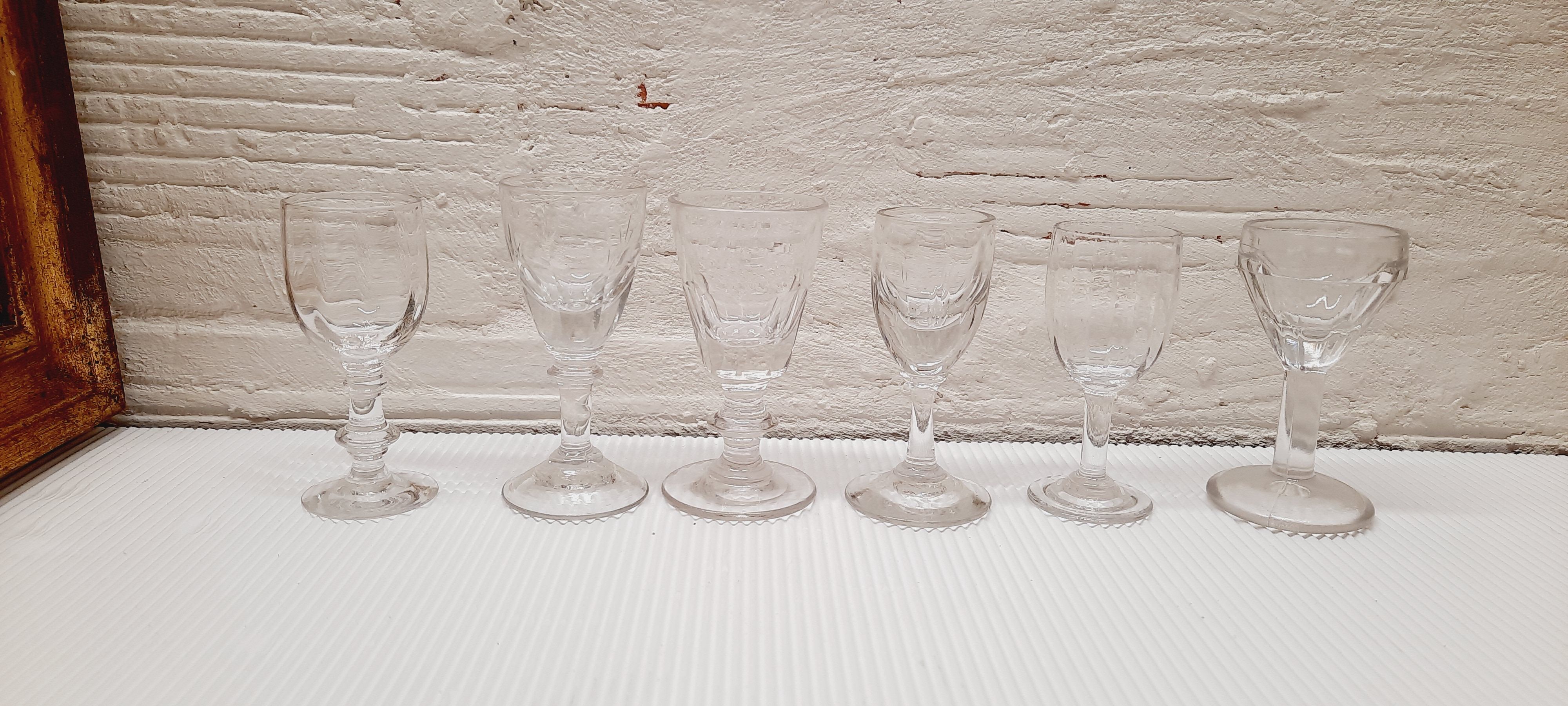 Lot 9 mismatched digestive glasses