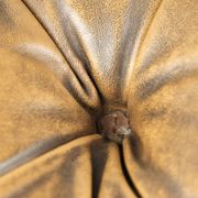 Elegant cowhide English chesterfield ottoman finished with decorative nails