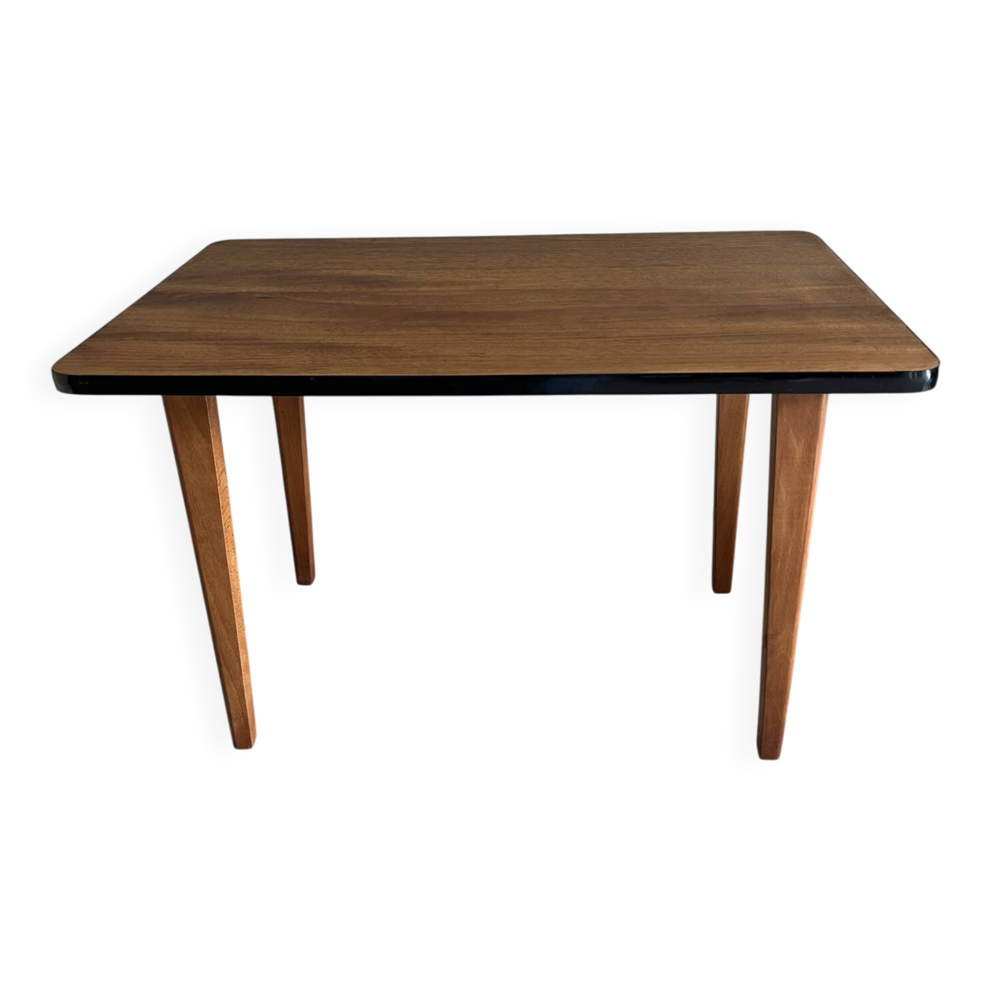 Mid-century coffee table with tapered legs.