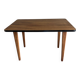 Mid-century coffee table with tapered legs.