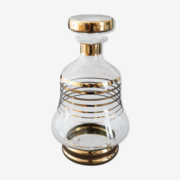 Glass liquor carafe decorated with gilded borders