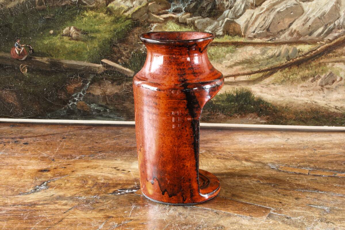 Signed orange ceramic candle holder and jug