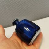 A small vase with blue running glaze with a ‘thin’ neck, from Swedish Kjell Sunesson