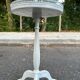 White tripod gueridon in Louis XVI style with a mirrored top, 1970.