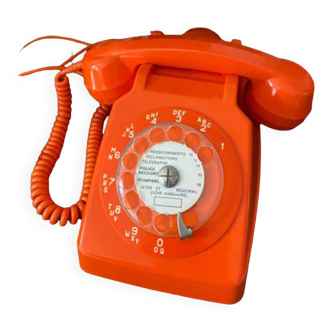 Orange rotary telephone