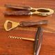 Bottle opener made of teak wood, corkscrew and nutcracker