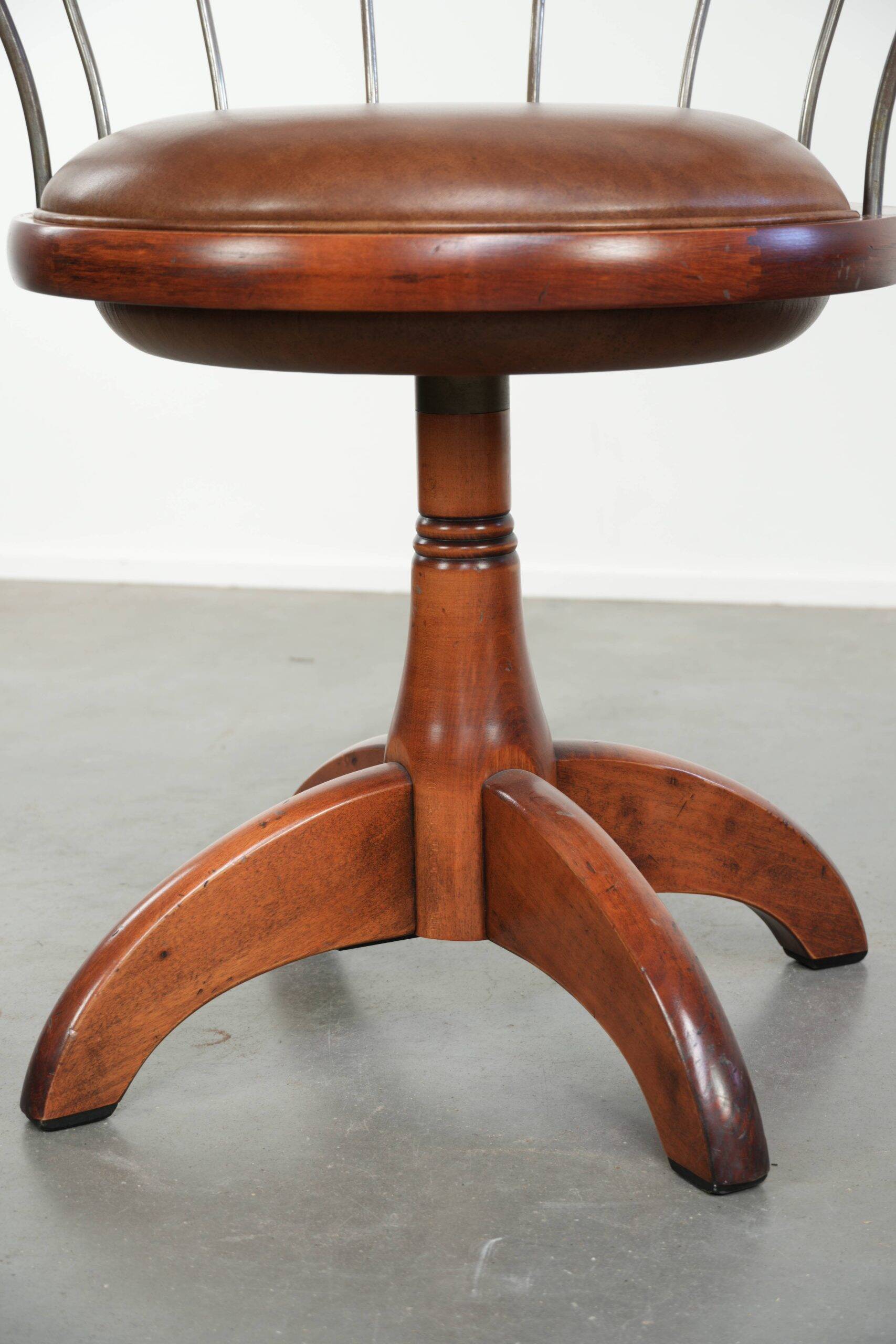 Set of 2 swivel/office chairs with a cognac-coloured cow leather seat