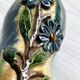 Very colorful glazed earthenware vase, old vase with floral decoration.