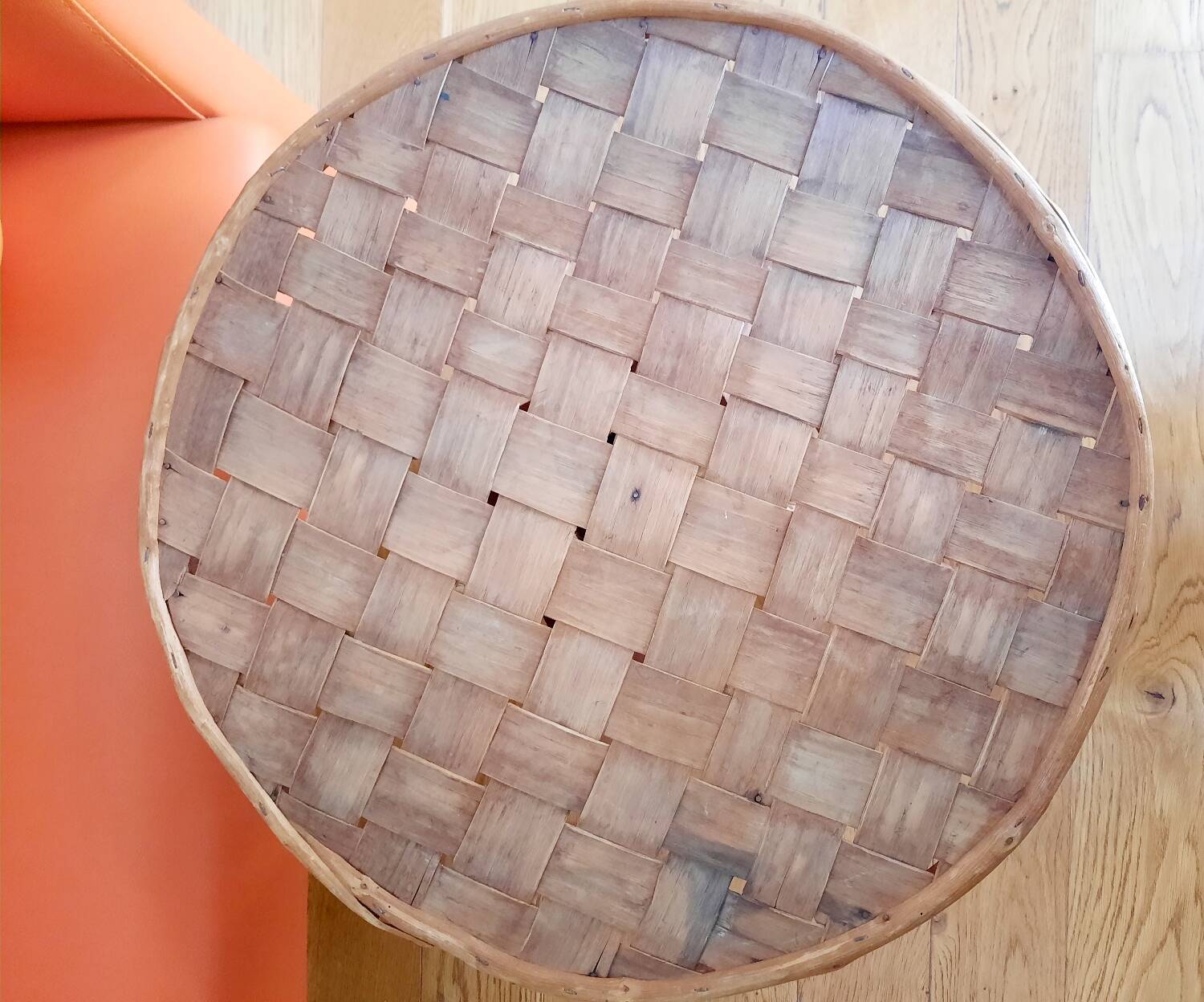 Old bamboo/rattan table with woven palm leaves.