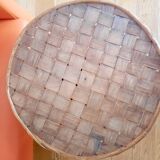 Old bamboo/rattan table with woven palm leaves.