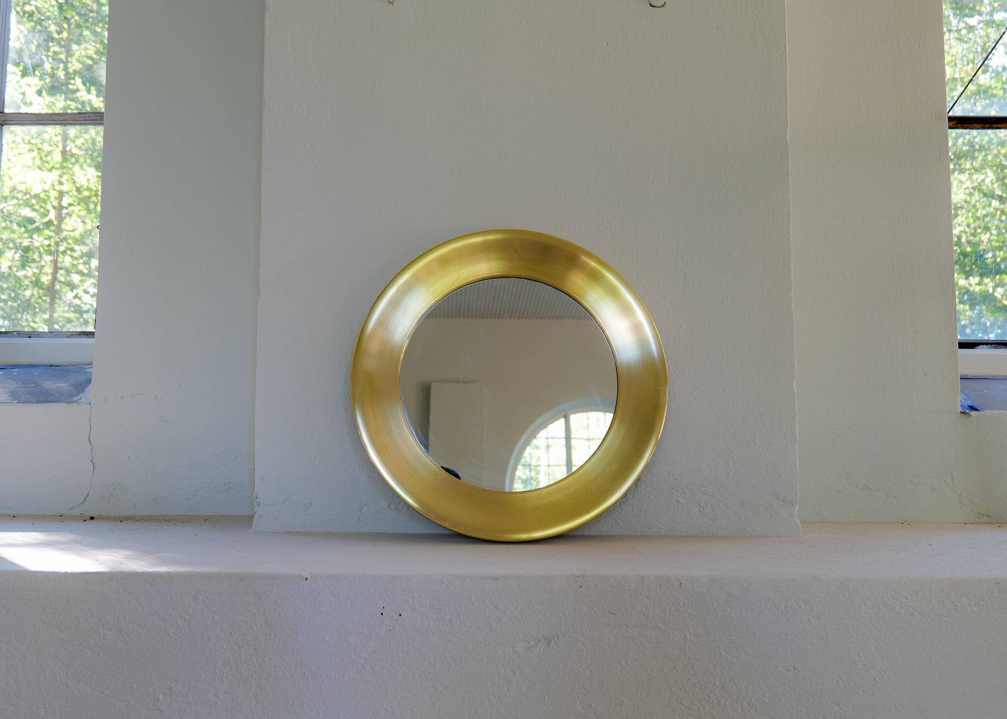 Modern round brass mirror from the mid-century by Glasmäster in Markaryd, Sweden, 1960s.