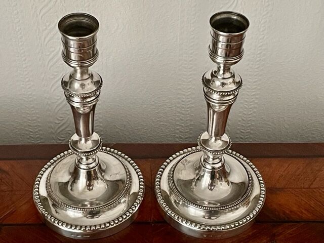 Pair of Christofle silver metal candle holders.