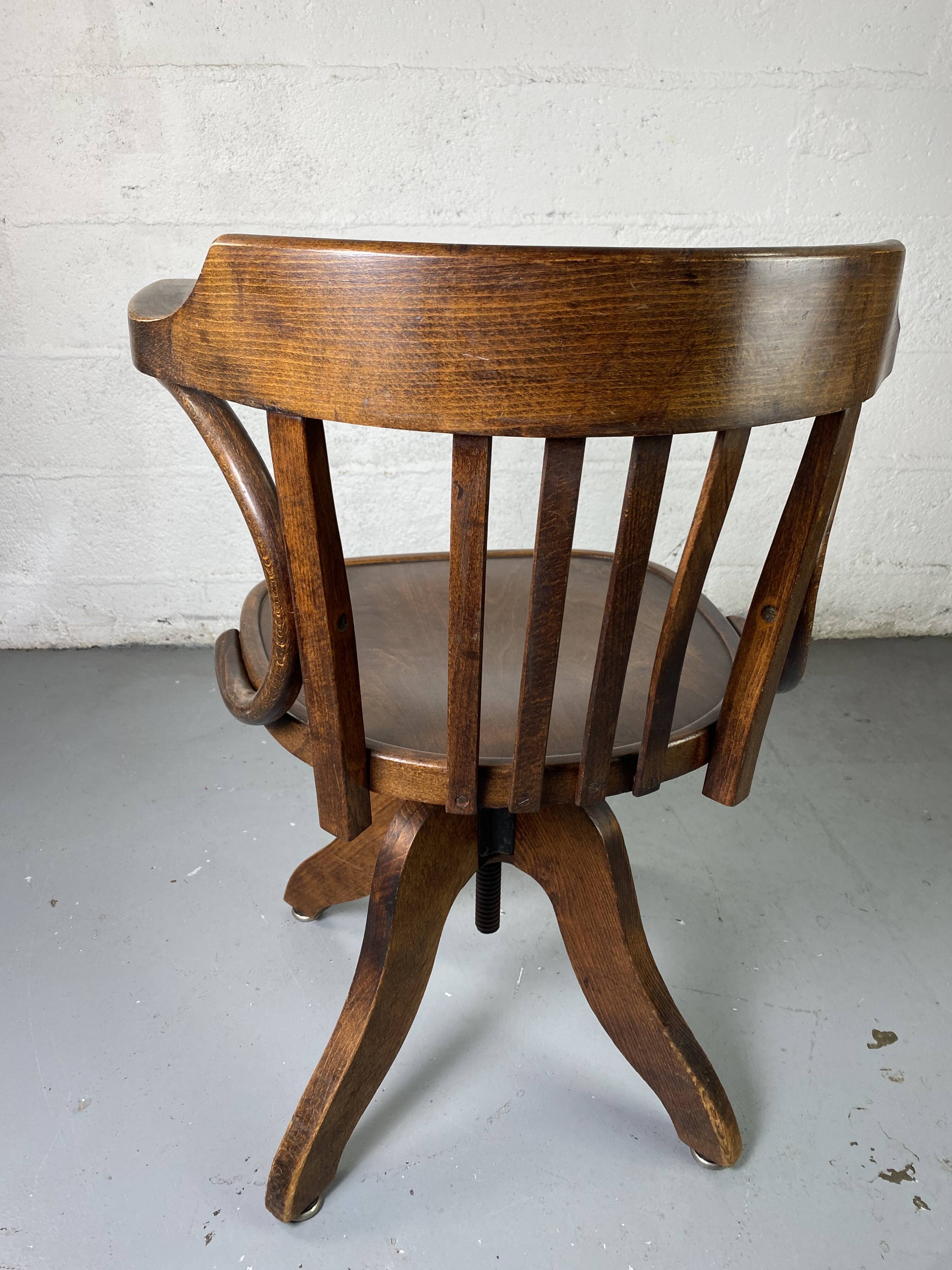 Baumann rotating wooden armchair