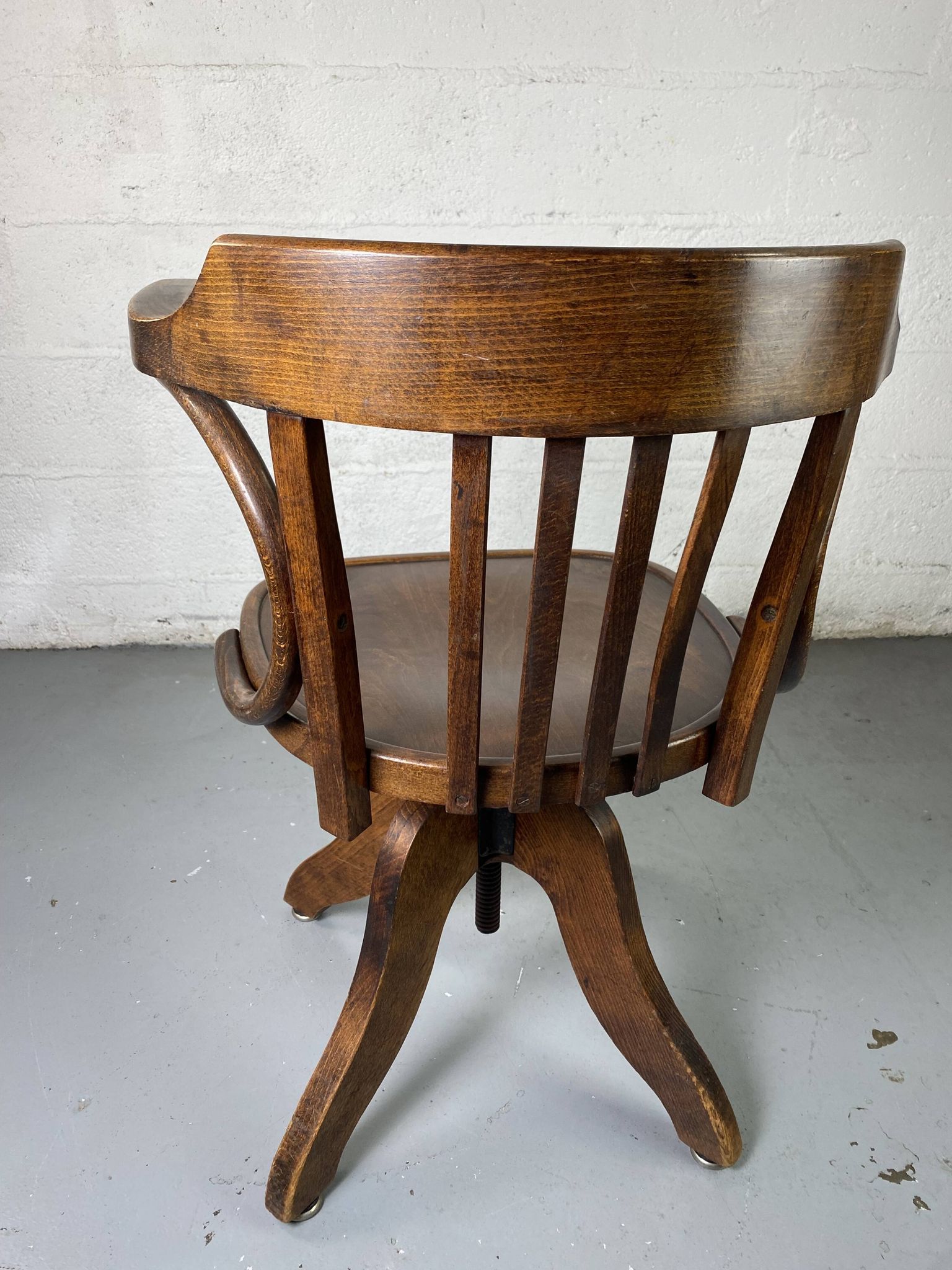 Baumann rotating wooden armchair