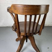 Baumann rotating wooden armchair