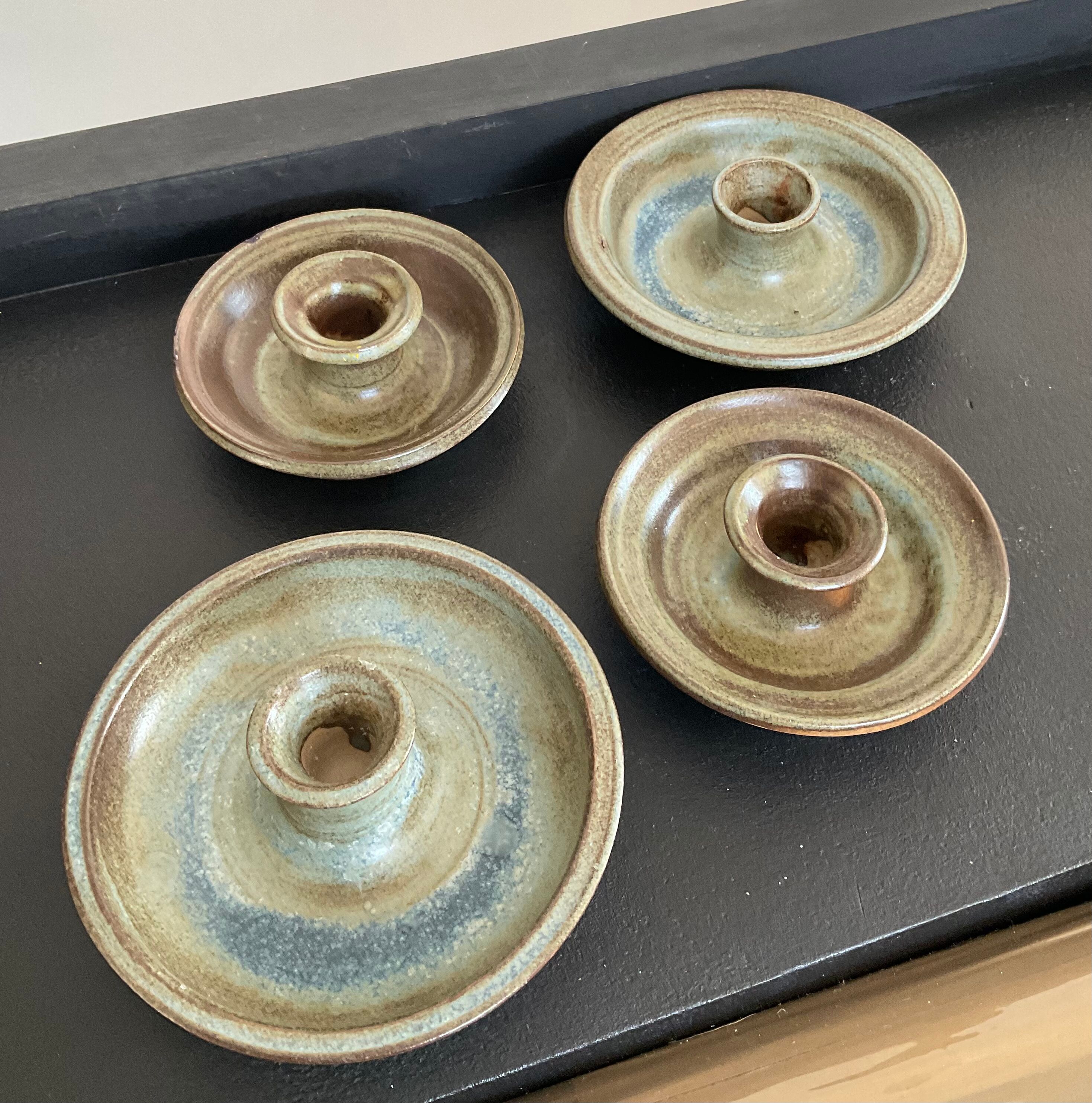 Series of 4 vintage stoneware candle holders