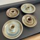 Series of 4 vintage stoneware candle holders