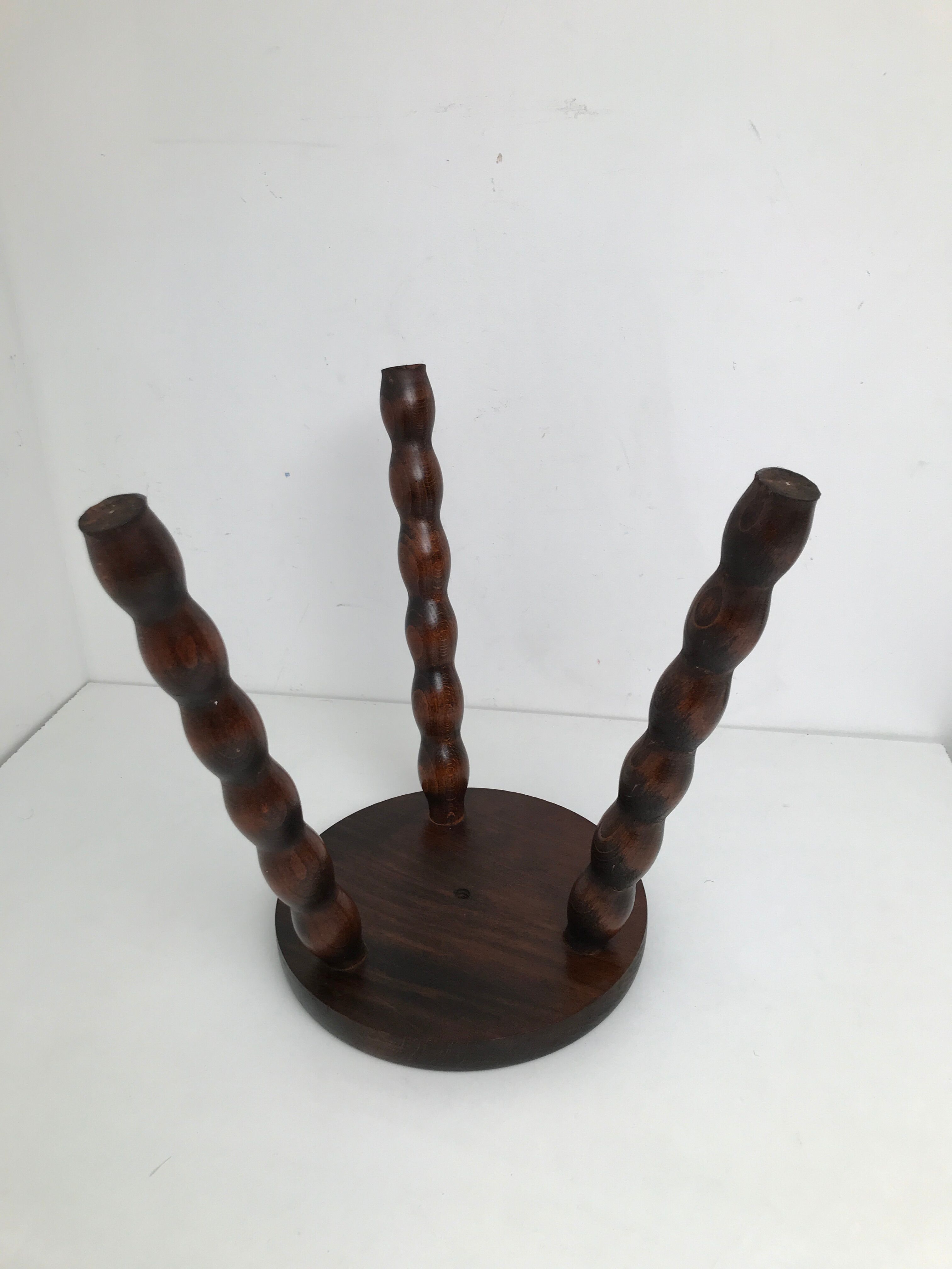 Wooden stool turned tripod foot