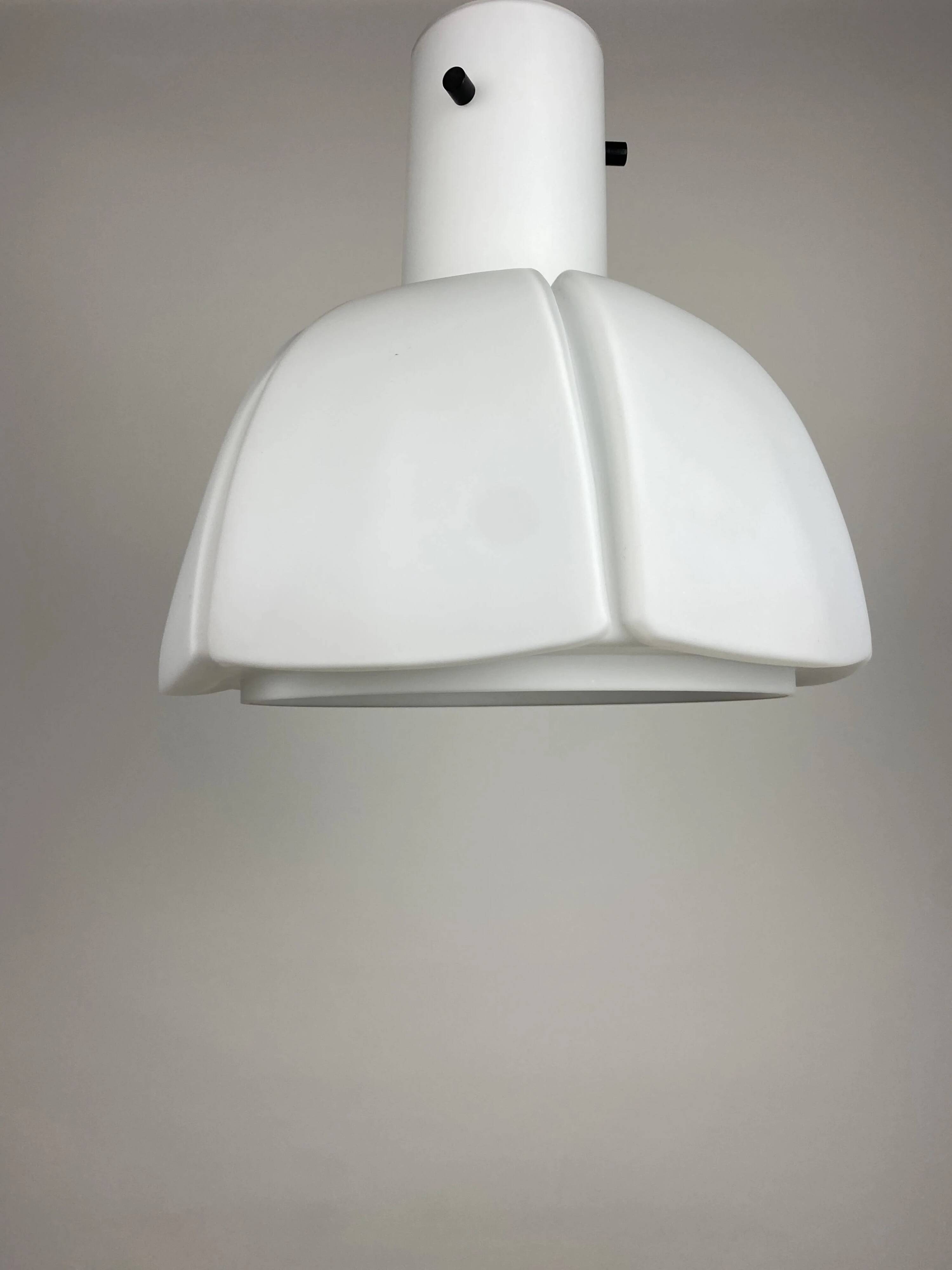 Frosted glass pendant in the shape of a white flower by Glashütte Limburg.