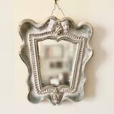 Small antique mirror in cracked ceramic with Commedia dell'Aigle mask decoration