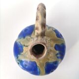 Vintage decanter in enamelled earthenware
