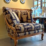 Armchair in a wooden confessional style with black and beige cotton.